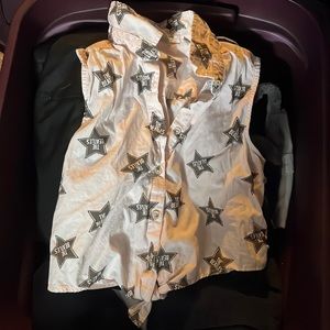 Girls size large , fits like a medium. Super cute sleeveless Beatles top!